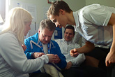  Eetu Vähäsöyrinki of the Nordic Combined team teaching President Niinistö how to knit. The scarves knitted by the athletes in the three Olympic Villages will be combined and given to the athletes of the Rio Summer Olympics. Team psychologist Hannaleena Ronkainen was also present to witness the President's knitting skills.  Copyright © Office of the President of the Republic