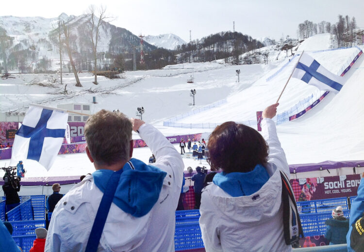  President Niinistö and Mrs Haukio watching the Flower Ceremony for Slopestyle from the bleachers. Copyright © Office of the President of the Republic 