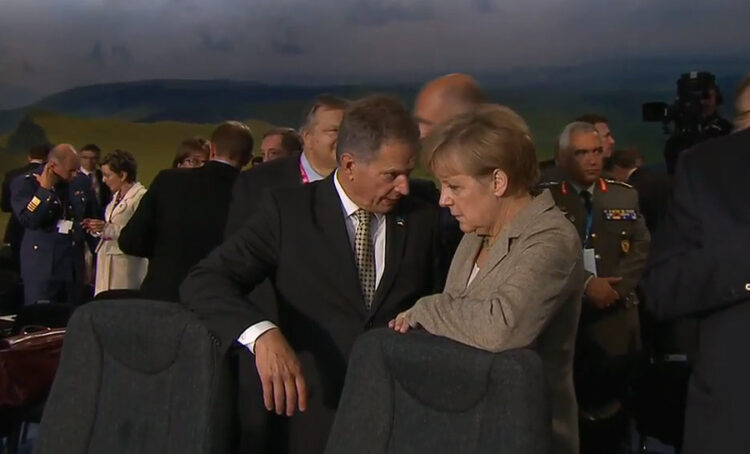 
President Niinistö talking with German Chancellor Angela Merkel before the Afghanistan meeting. Picture: NATO livestream.