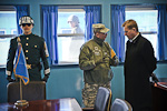  President Niinistö viewing the negotiation room, which is located squarely on the border between South and North Korea. North Korean soldiers observe from the other side of the window. Copyright © Office of the President of the Republic of Finland