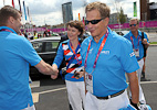  Finnish Olympic Committee Sports Director Kari Niemi-Nikkola (left) and President Roger Talermo (background) welcomed the presidential couple to the Olympic Village.   Photo: Lehtikuva 
