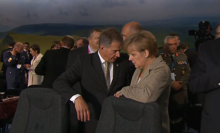 
President Niinistö talking with German Chancellor Angela Merkel before the Afghanistan meeting. Picture: NATO livestream.