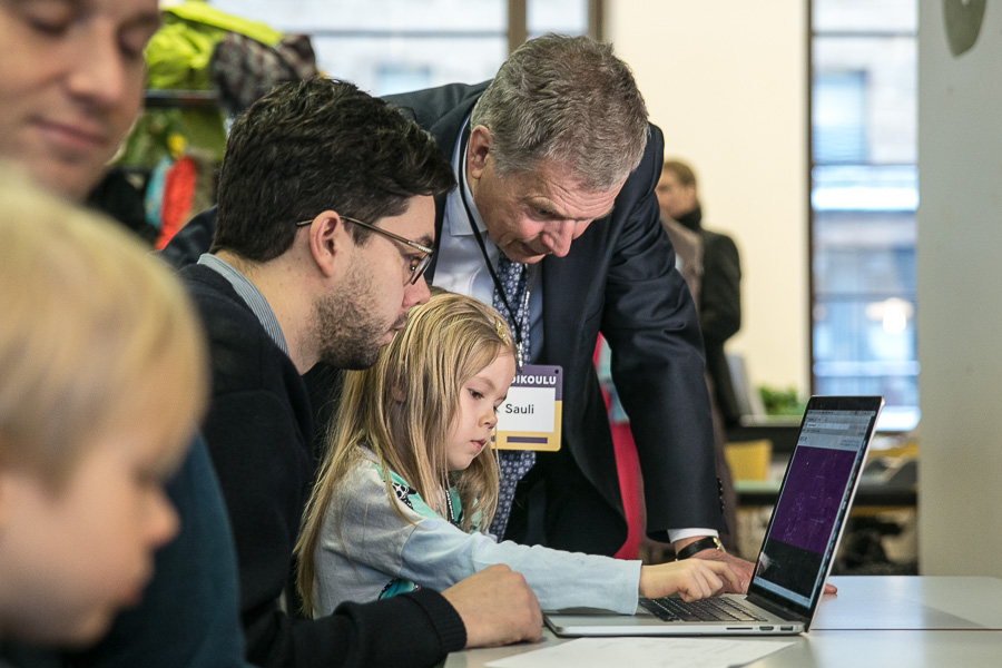 5-year-old Ulla Schulman demonstrated her coding skills to the president, with her father Johan Schulman looking on. Copyright © Office of the President of the Republic of Finland